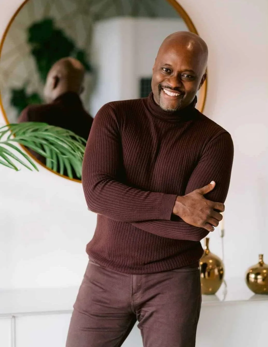 Adam Stanley in wine sweater and slacks